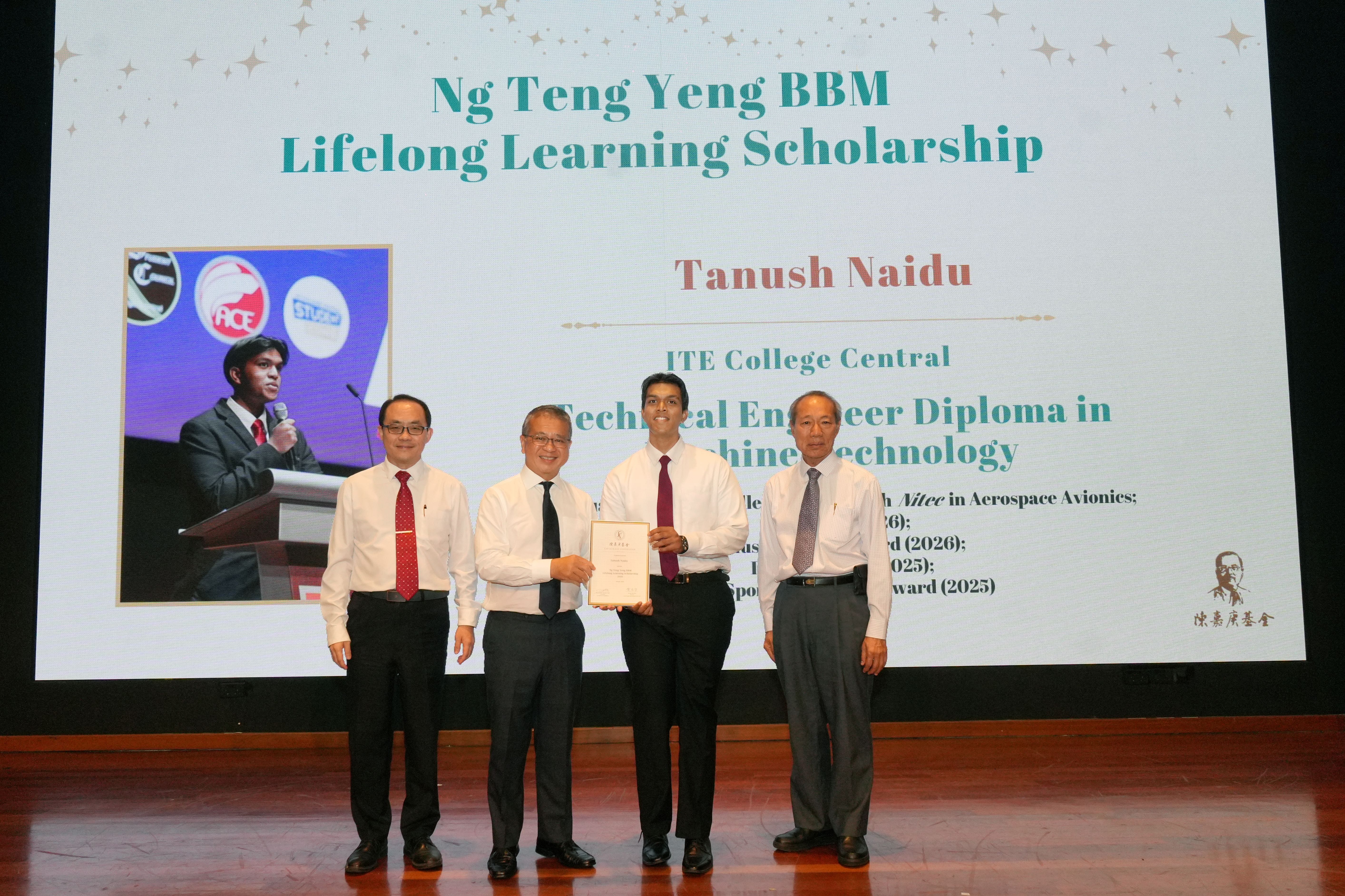 Recipient receiving scholarship on stage